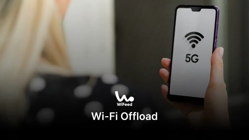 Pessoa segurando um smartphone com a tela exibindo o símbolo de Wi-Fi 5G e o texto Wi-Fi Offload, indicando uma conexão de internet móvel de alta velocidade. 