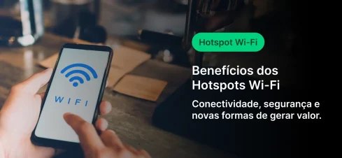 Imagem mostrando uma pessoa segurando um celular com o símbolo de Wi-Fi, simbolizando conectividade e benefícios de hotspots Wi-Fi para geração de valor e segurança.