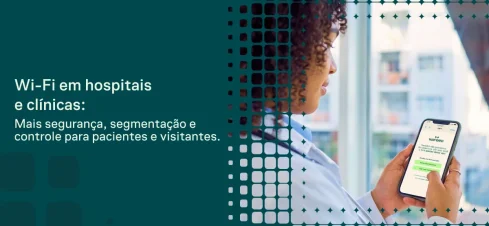 Wi-Fi em hospitais e clínicas com segurança e segmentação: profissional de saúde usa um celular para acessar informações em ambiente clínico, com interface visual digital ao fundo.