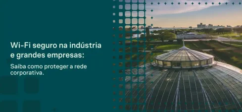 Imagem com fachada corporativa ao pôr do sol e sobreposição gráfica de rede conectada; texto em destaque: “Wi-Fi seguro na indústria e grandes empresas: Saiba como proteger a rede corporativa.”