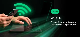 Mão usando smartphone e notebook com ícones de Wi‑Fi e sinal verde, mostrando o tema “Wi‑Fi 6” e destacando vantagens para redes corporativas em um layout de comunicação digital.